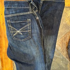 Woman’s Cinch Shannon jeans 28 extra long mid rise. Dark stone wash